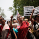 Demonstrators protest the death of two teen girls killed in New Delhi.